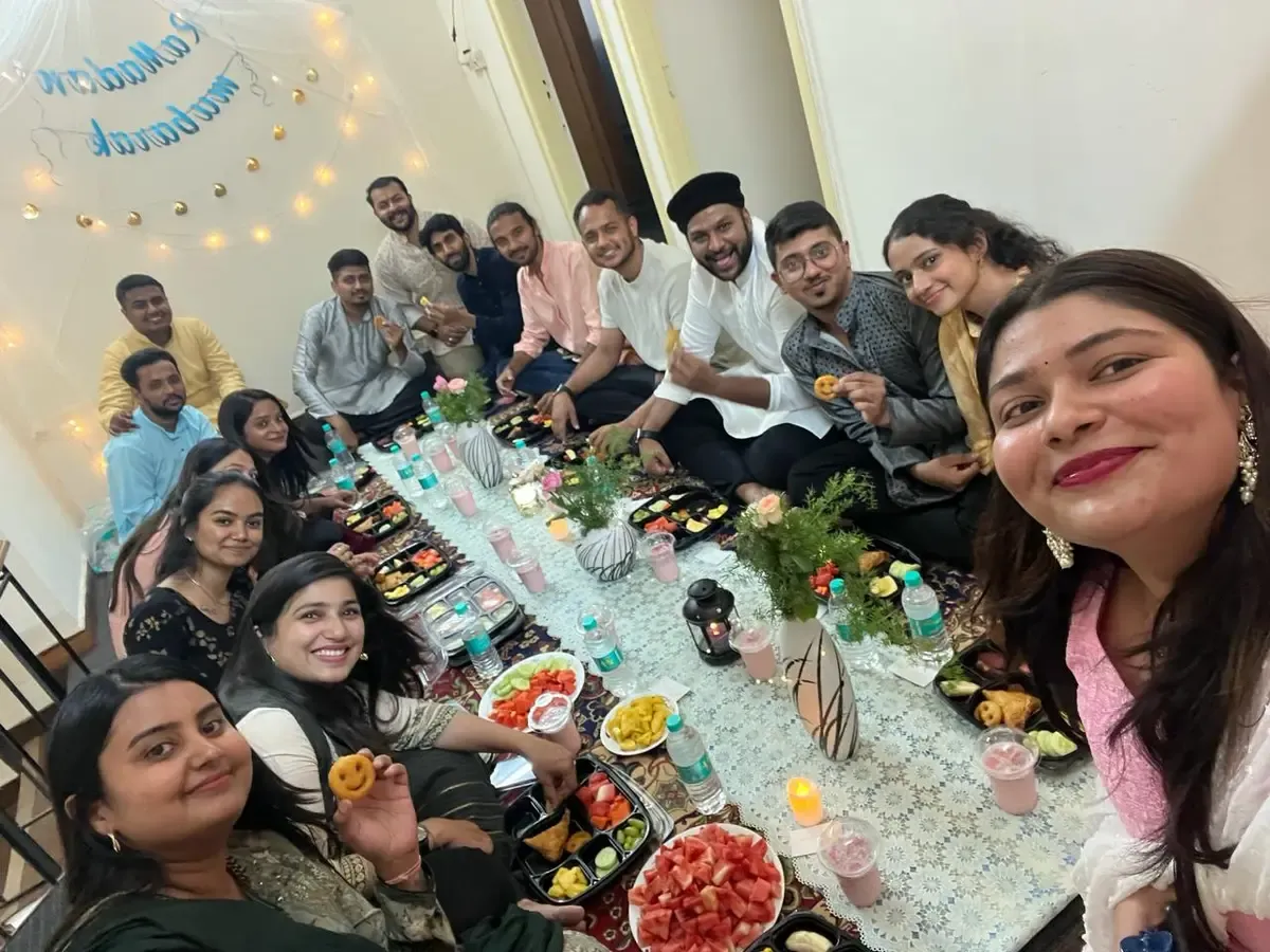 The team around a long table at a shared meal